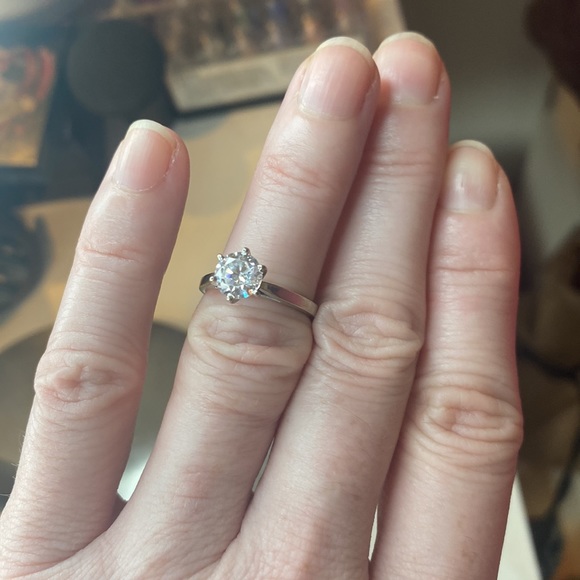 This perfect imitation colorless stone.  Size 5 1/4 done is solid 14k gold.